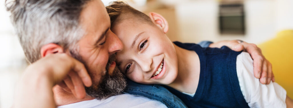 9 Ideas for Father’s Day Mature father with small son sitting on sofa indoors, resting.